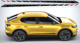 Yellow SUV with black roof rack and side decals on a gray background