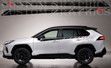A Toyota Rav4 with custom racing stripes decals in black, red, and white colors applied on its side.