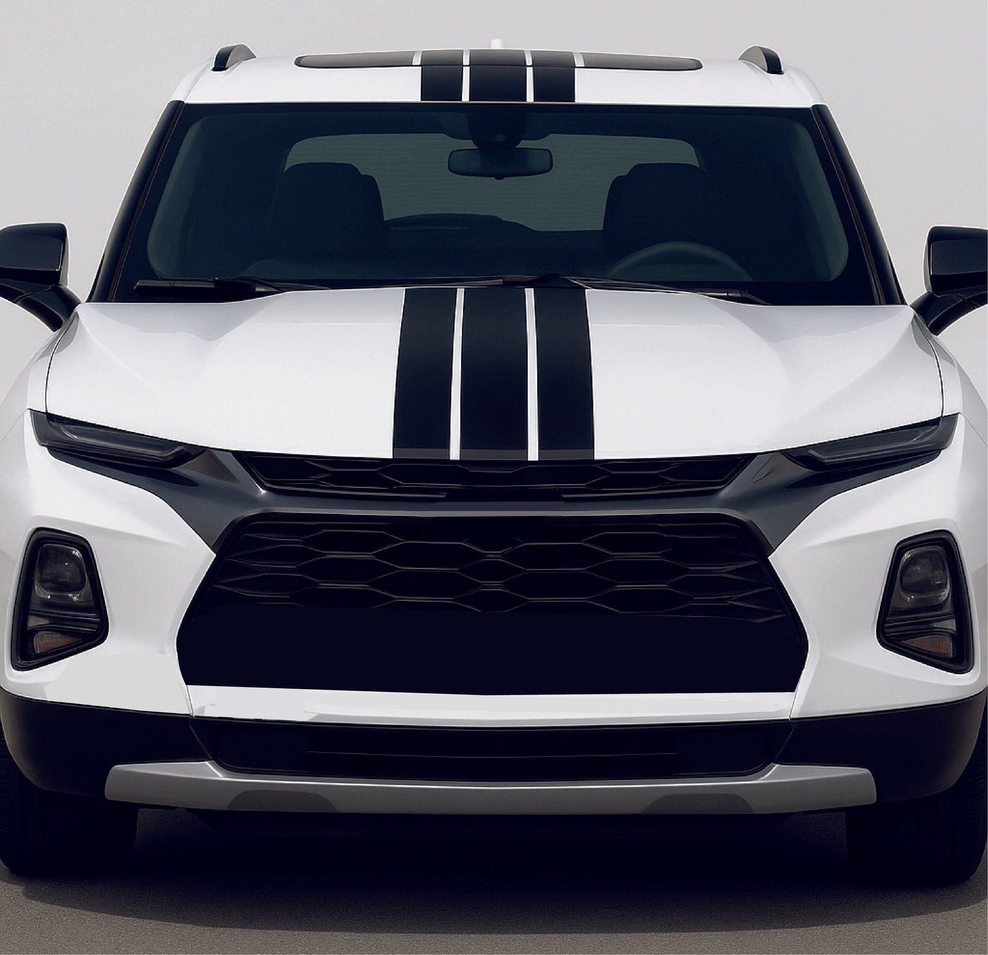 White SUV with black stripes on a gray background