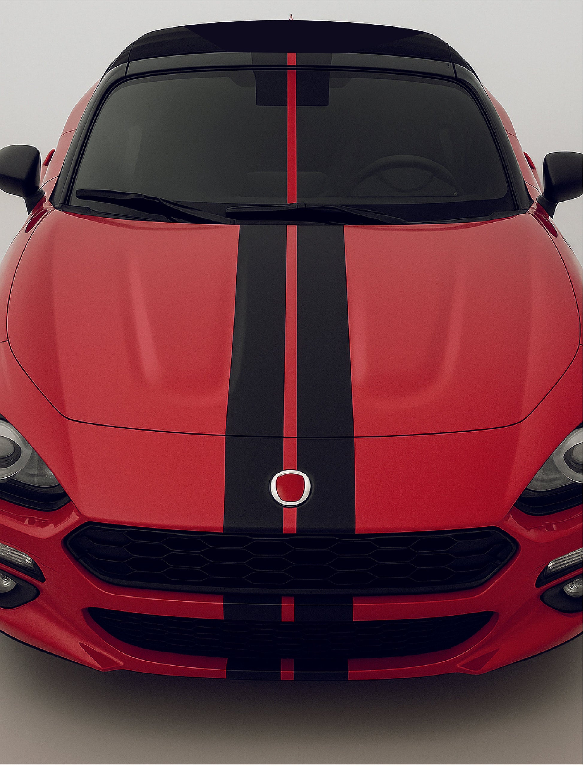 Red car with black stripes on a gray background