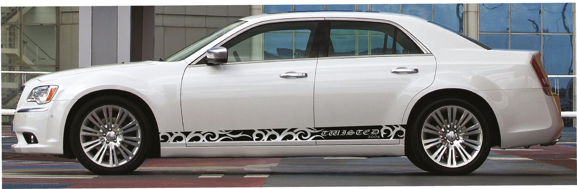 White car with decorative decal on a city street background