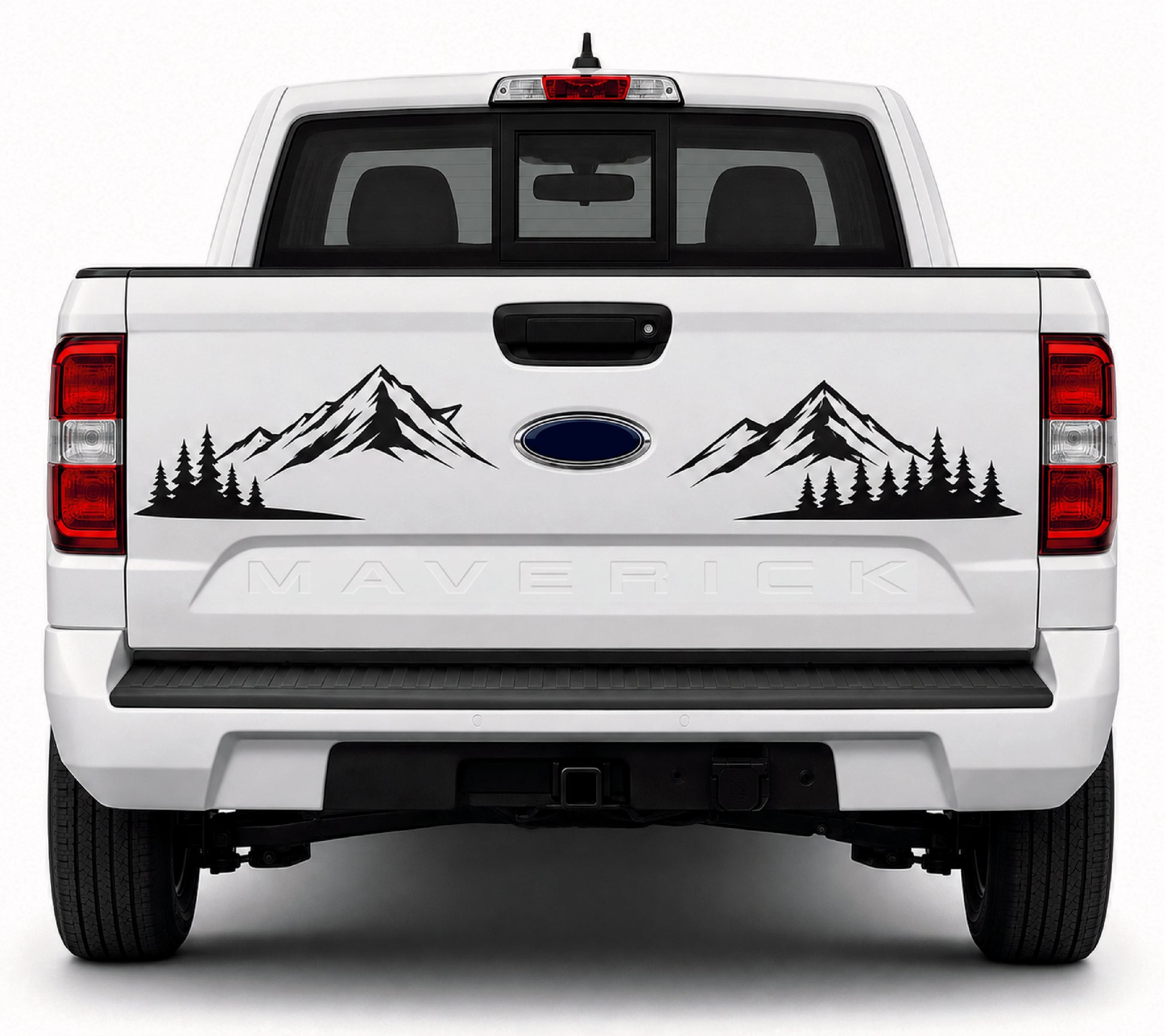 Rear view of a white Ford Maverick pickup truck with black mountain and pine tree vinyl decals on the tailgate, centered on a light gray background.