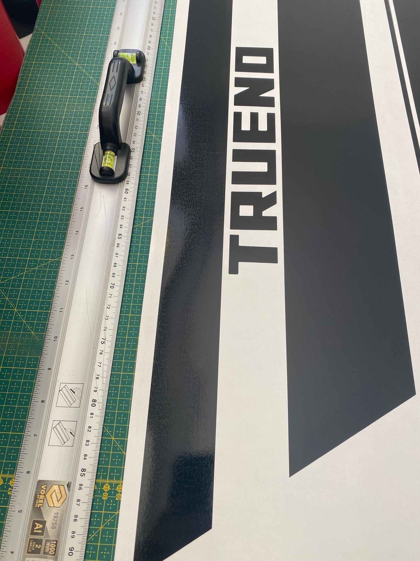 A close-up of a black and white checkered premium vinyl sticker with the word 'TRUENO' designed for compatibility with Toyota GR 86 vehicles.