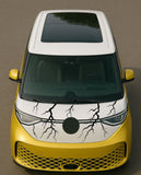 Yellow car with a unique design on the front, featuring a black circle and lightning bolts.