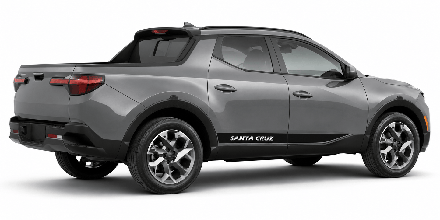 A gray compact pickup truck shown from a three-quarter rear angle on a clean white background. The vehicle has black trim along the lower body and side, silver multi-spoke wheels, and 'SANTA CRUZ' printed in white on the side panel.