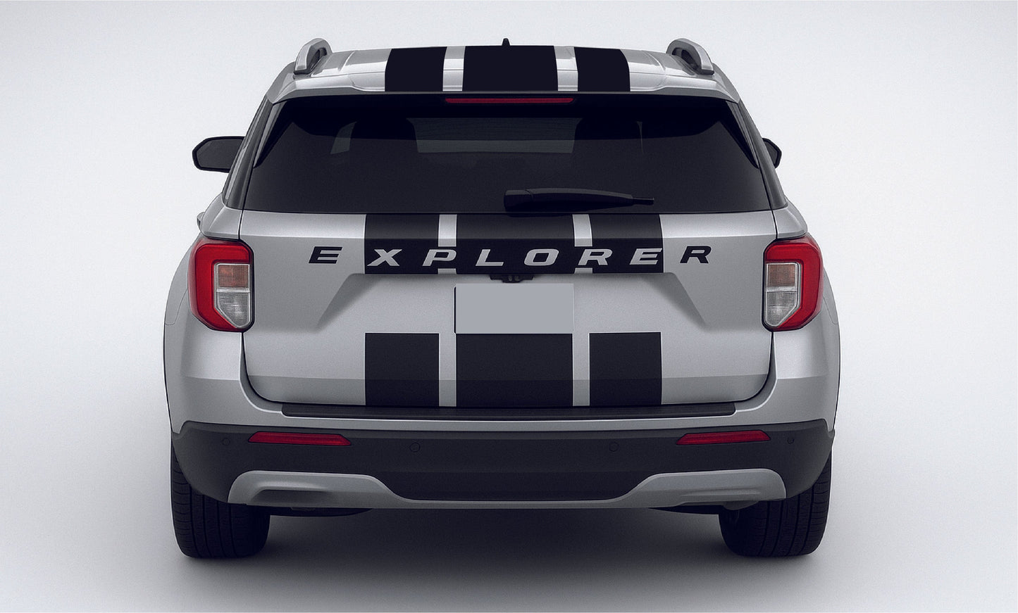 Back view of a silver Ford Explorer with black and white stripes on a white background