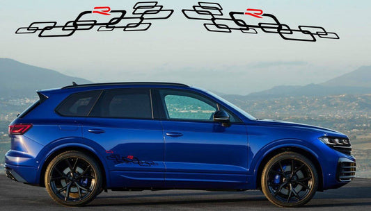 A blue VW Touareg SUV with a set of custom vinyl stickers designed for the vehicle, displayed on a background with mountainous landscape.