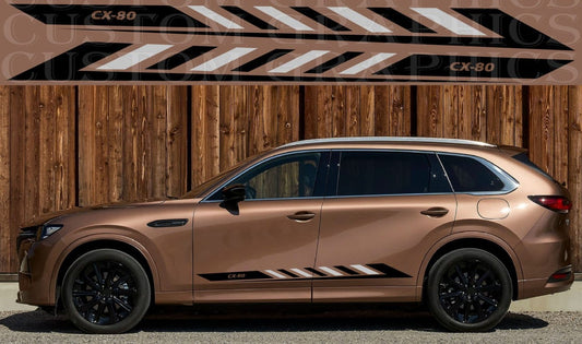 Bronze SUV with black accents parked against a wooden wall with 'CX-80' branding.