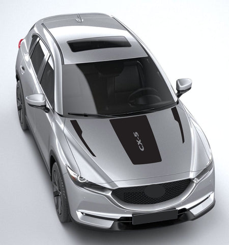 Silver car with 'CX-5' branding on a light gray background