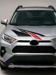 Silver SUV with a black and red stripe on the hood against a gray background