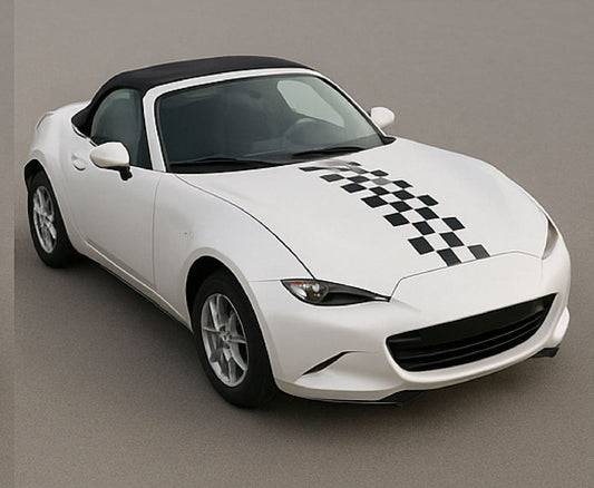 White convertible car with black checkered design on a gray background