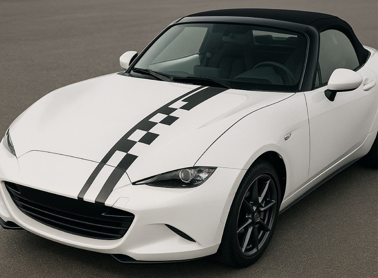 White convertible car with black racing stripes on a gray road