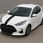 White car with black stripes on a gray background
