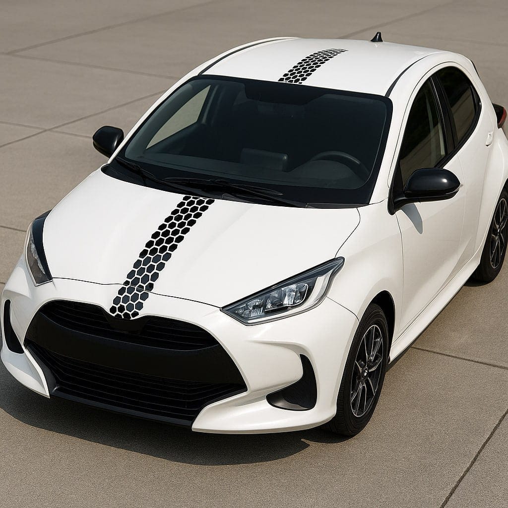 White car with black honeycomb design on a gray pavement