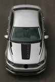 Top-down view of a silver car with a black stripe on a dark background