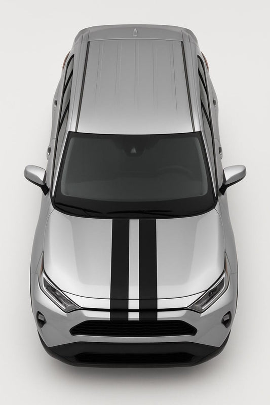 Top-down view of a silver car with black stripes on a white background
