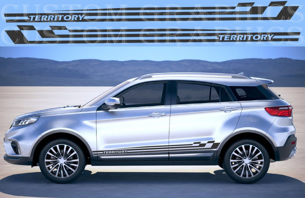A silver SUV shown in side profile on a desert-like backdrop with mountains in the distance. The vehicle has black decorative side decals with the word TERRITORY repeated.
