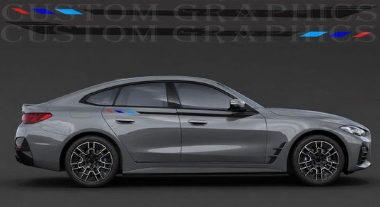 A side profile view of a gray BMW sedan with a custom blue and red M-style stripe decal running along the side window trim, set against a dark gray studio background with a 'Custom Graphics' watermark.