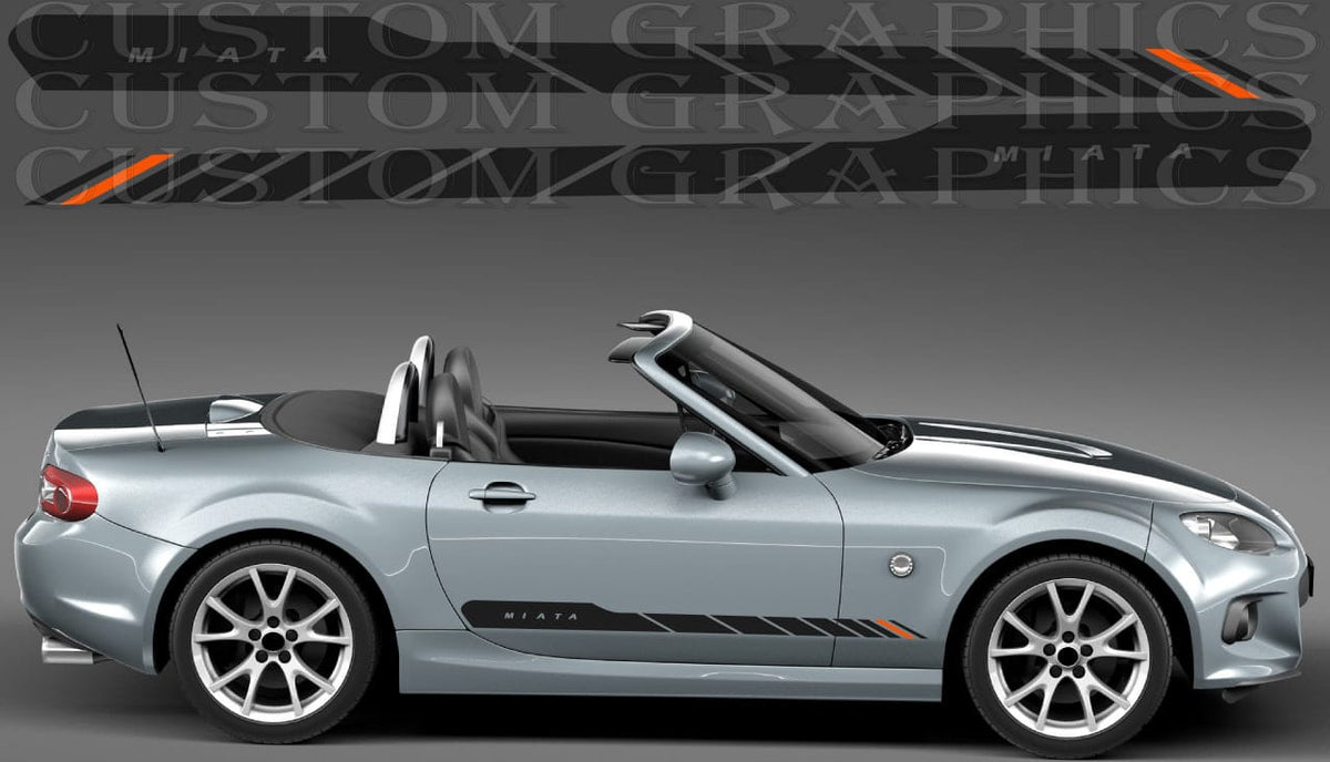 A silver Miata convertible car shown in side profile on a dark gray studio background, with a large repeated 'CUSTOM GRAPHICS' watermark across the top and black side decals with orange accents applied to the vehicle.