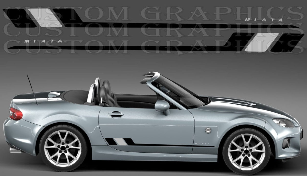 A silver convertible sports car shown in side profile on a gray studio background, with black and white graphic decals displayed above. The decals include the word 'MIATA' and angular stripe designs, suggesting a car wrap or decal product.