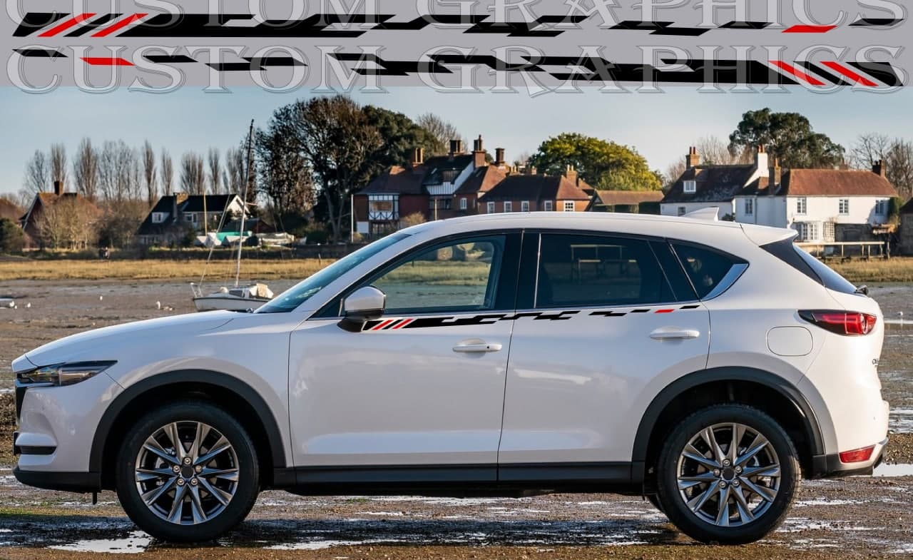 A white Mazda CX-5 SUV with vinyl stripes decals on the sides, displayed against a road and landscape backdrop.