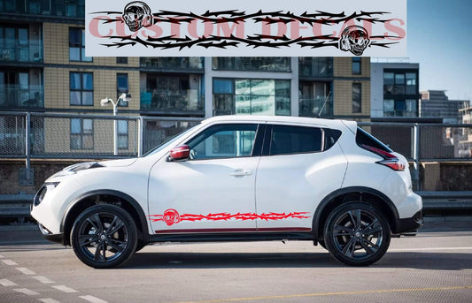 A white Nissan Juke vehicle with a pair of black premium vinyl stickers featuring a skull design on the side.